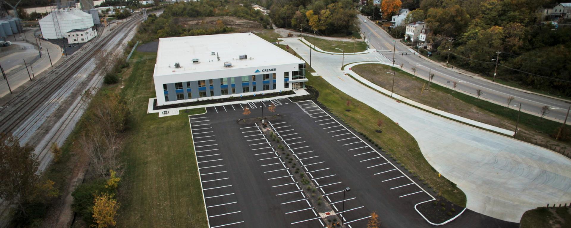 aerial of front profile and parking lot and entry drive