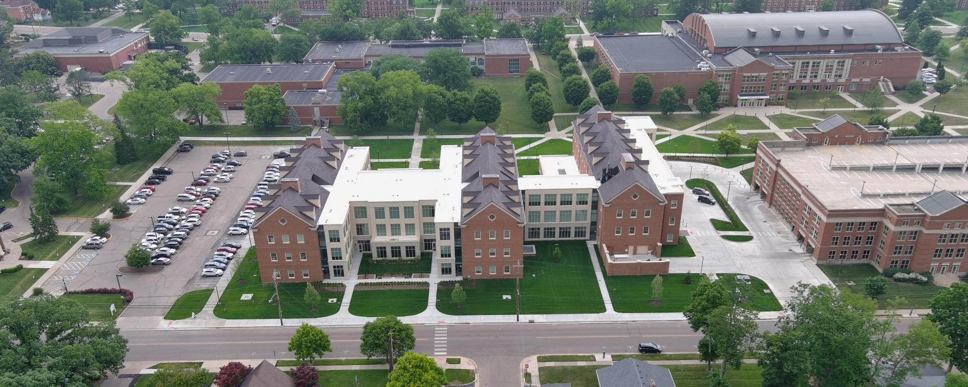 aerial photo of brick building and green lawn
