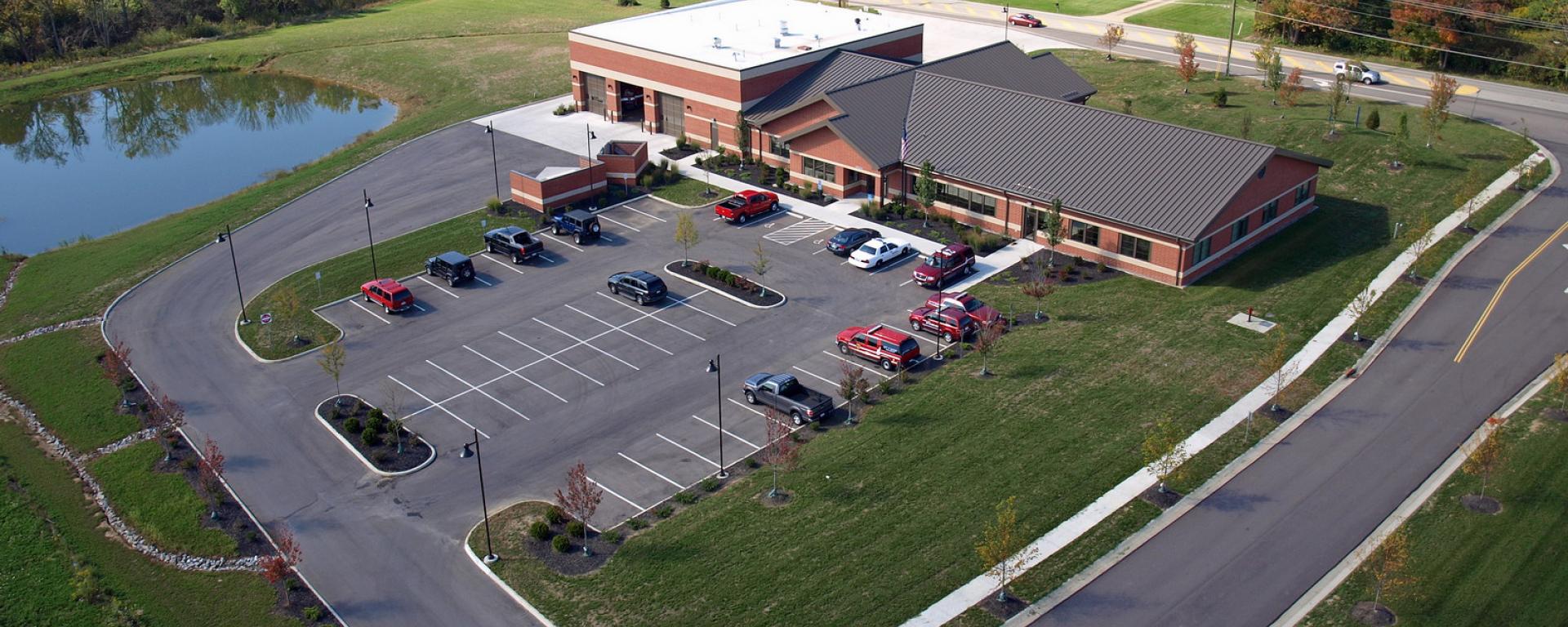 aerial of back parking lot and back profile of firehouse