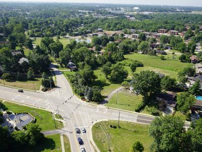 aerial photo of a roadway intersection with blue sky