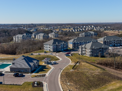 aerial photo of apartment buildings on a hill with a road