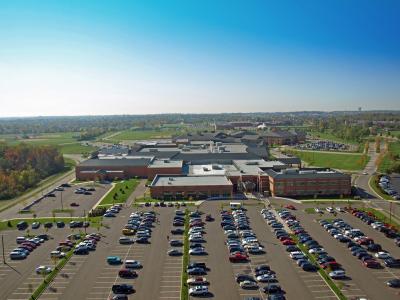 aerial of parking lot and front of building