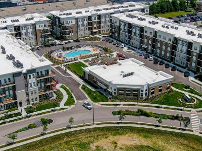 aerial photo of apartment building and winding road